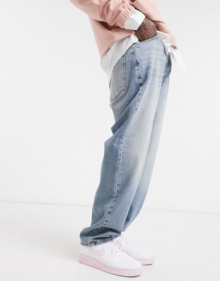 ASOS DESIGN baggy jeans in tinted light wash blue - ShopStyle