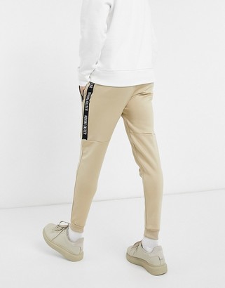 Bershka sweatpants with taping in beige scuba - ShopStyle Activewear Pants