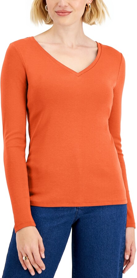orange v neck long sleeve shirt