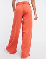 Thumbnail for your product : Nike mini swoosh high waisted wide leg joggers in red