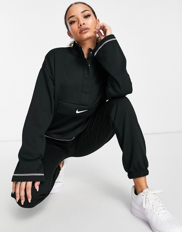 Nike Swoosh quarter zip funnel sweatshirt in black - ShopStyle
