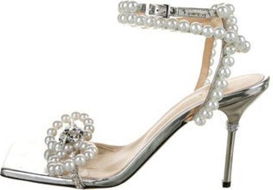 MACH & MACH Leather Sandals Silver Faux Pearl Accents Crystal Embellishments & Crystal Trim Wrap-Around Straps & Buckle Closure at Ankles Unfortunately, due to restrictions, this item may not be eligible for shipping in all areas.