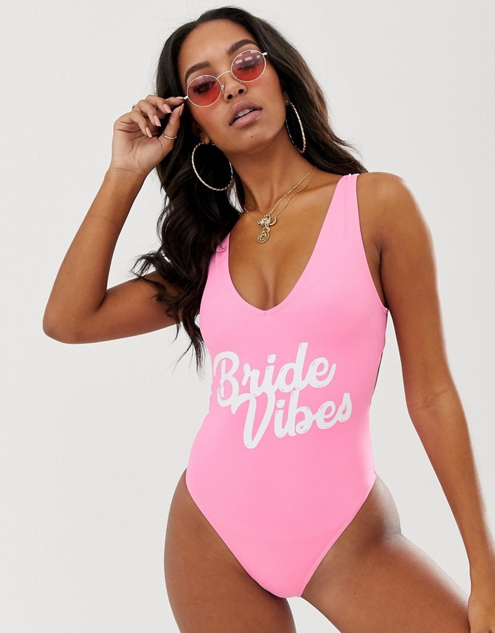 ASOS DESIGN recycled 'bride vibes' slogan hen plunge lace up back swimsuit in pink