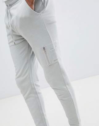 ASOS Design Skinny Joggers With Ma1 Pocket In Light Grey