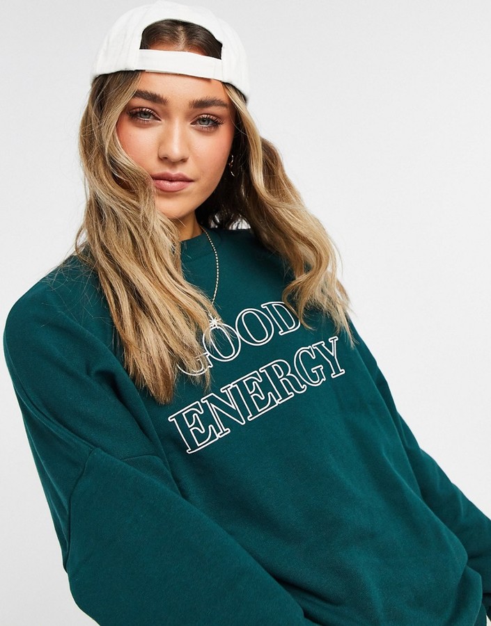 ASOS DESIGN sweatshirt with good energy graphic in forest green - ShopStyle