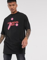 Thumbnail for your product : ASOS DESIGN oversized longline t-shirt with front and back print in acid wash with nibbled neck detail and side splits