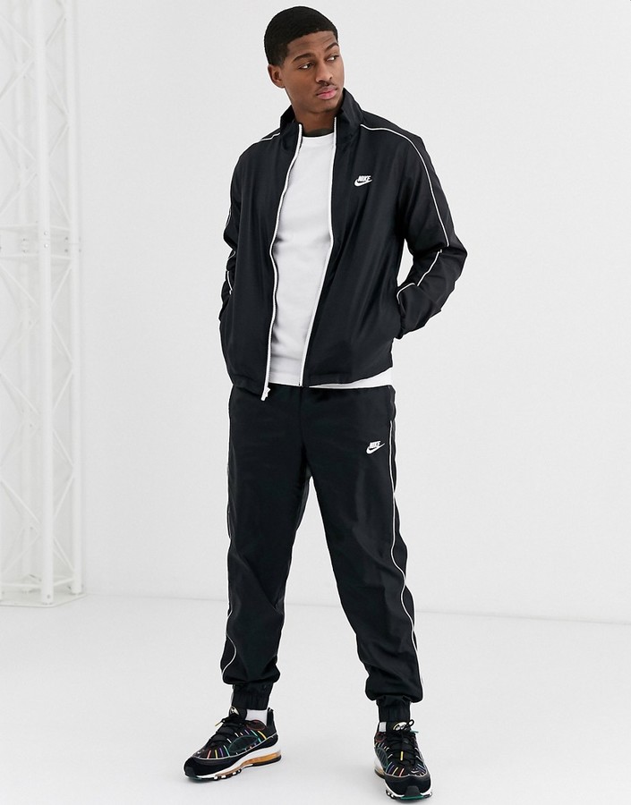 Nike woven tracksuit set in black - ShopStyle Chinos & Khakis