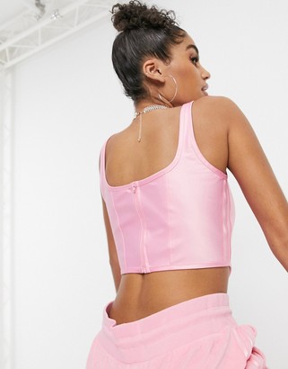 adidas Relaxed Risqué satin look corset in vibrant pink