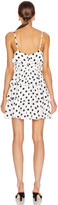 Thumbnail for your product : ICONS OBJECTS OF DEVOTION Objects of Devotion Ruffle Stacked Mini Dress in White & Black Polka Dot | FWRD