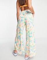 Thumbnail for your product : Billabong Wandering Soul beach trouser in multi floral print