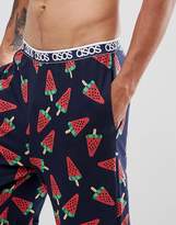 Thumbnail for your product : ASOS Design DESIGN straight pyjama bottoms in melon print in organic cotton-Navy