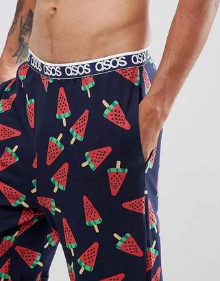 ASOS Design DESIGN straight pyjama bottoms in melon print in organic cotton-Navy