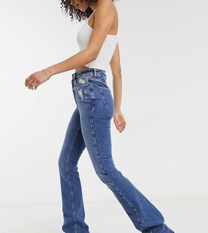 New Look Tall flared jeans in mid blue - ShopStyle