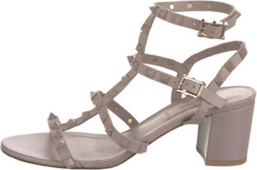 Valentino Leather Gladiator Sandals Neutrals Rockstud Accents Studded Accents Multistrap & Buckle Closure at Ankles Unfortunately, due to restrictions, this item may not be eligible for shipping in all areas.