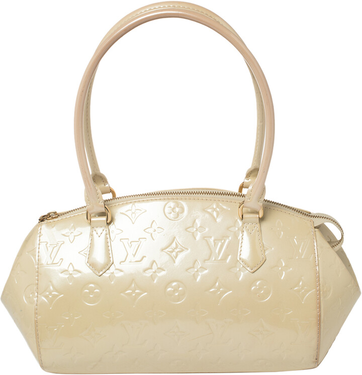 louis vuitton cream handbolsa