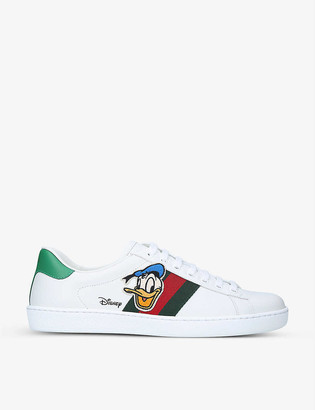 Gucci Women's x Disney New Ace Donald branded leather trainers - ShopStyle  Low Top Sneakers