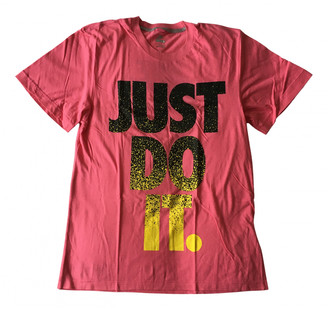 red and pink nike shirt