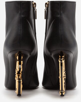 Thumbnail for your product : Dolce & Gabbana Nappa leather ankle boots with baroque detail