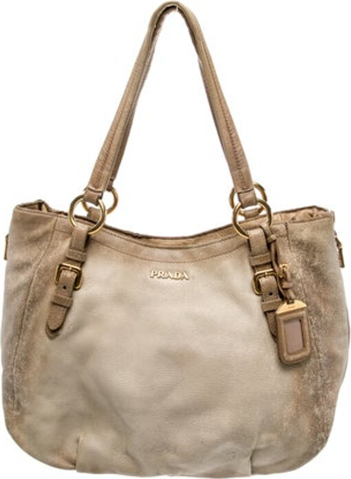 Prada Bucket Bag Neutrals Vitello Phenix Leather Multitonal Hardware Dual Adjustable Shoulder Straps Logo Jacquard Lining & Dual Interior Pockets Snap Closure at Top Includes Dust Bag & Luggage Tag Unfortunately due to restrictions this item may not be eligible for shipping in all areas.