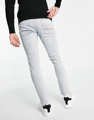 ASOS DESIGN stretch slim jeans in vintage light wash with knee rips -  ShopStyle