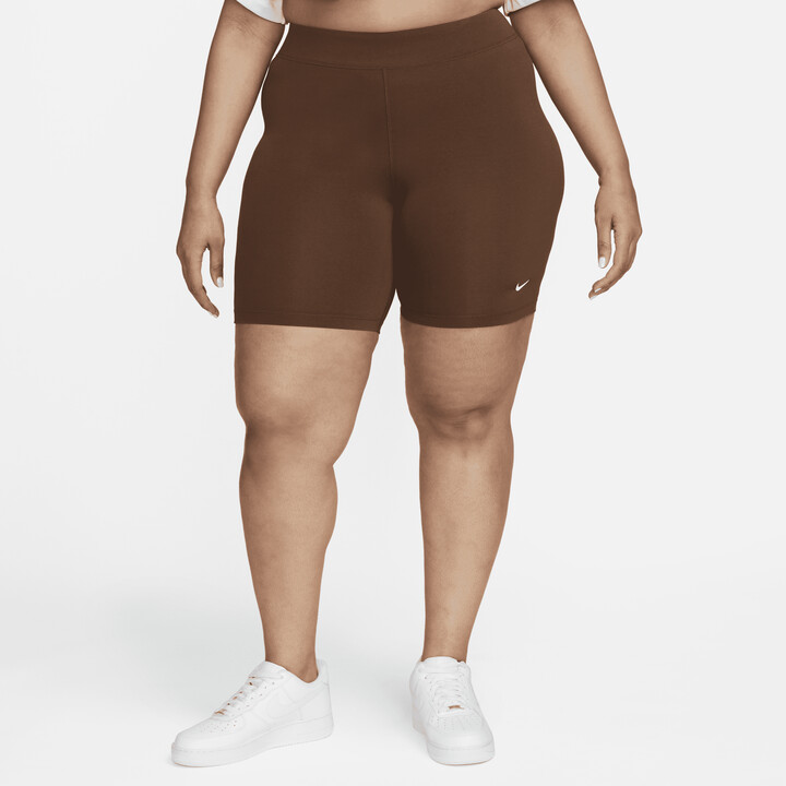 https://img.shopstyle-cdn.com/sim/ef/ee/efeecfb3f3401cf79110983726bcba45_best/womens-nike-sportswear-essential-mid-rise-bike-shorts-plus-size-in-brown.jpg
