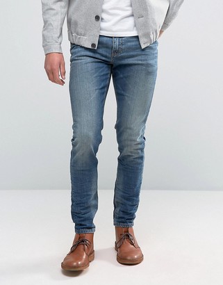ASOS DESIGN Skinny Jeans In 12.5oz Mid Blue