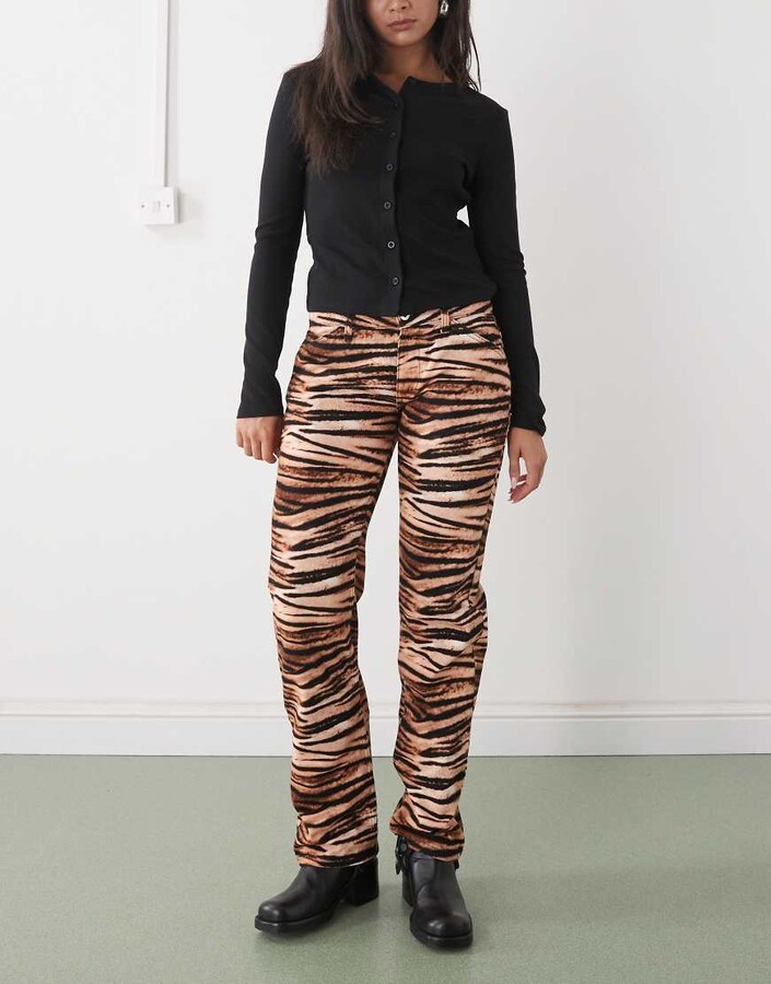 Collusion low waist slim bootcut jeans in tiger print