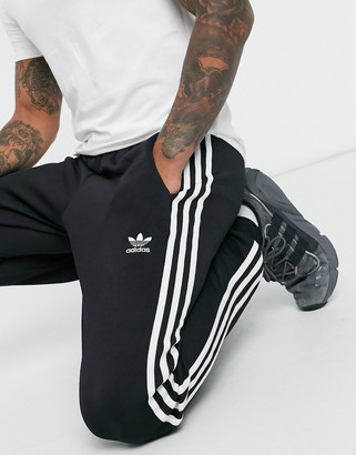 adidas adicolor three skinny sweatpants in - ShopStyle Activewear