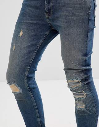 ASOS Extreme Super Skinny Jeans In Dark Wash Vintage With Rip And Repair