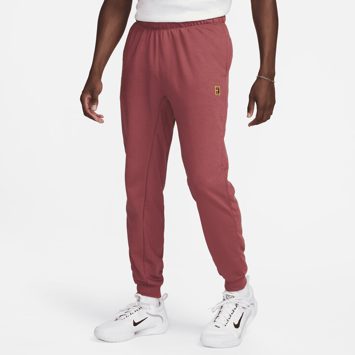 https://img.shopstyle-cdn.com/sim/f0/95/f095c89b878fb8c5b90349a22e4fc89e_best/nike-mens-court-heritage-french-terry-tennis-pants-in-red.jpg