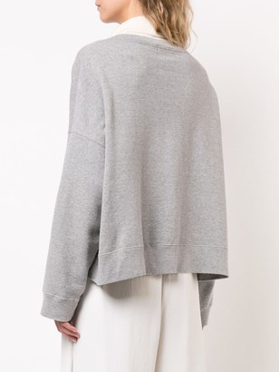 Undercover Embroidered Curved Hem Sweatshirt