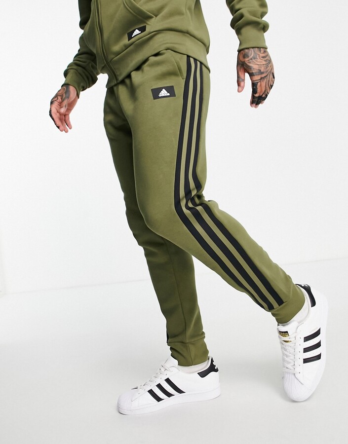 adidas Sportswear joggers with three stripes in khaki - ShopStyle Trousers