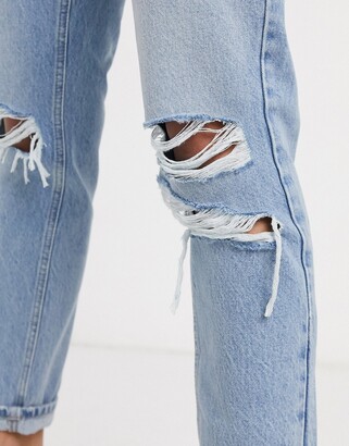 Topshop mom jeans with super rips in bleach