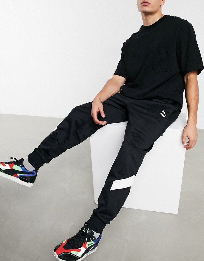 Puma Iconic MCS cuffed track pants in black - ShopStyle