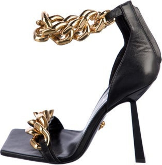 Versace Leather Sandals Black Chain-Link Accents Wrap-Around Straps & Concealed Zip Closure at Ankles Unfortunately, due to restrictions, this item may not be eligible for shipping in all areas.