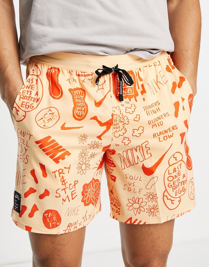 Nike Running Dri-FIT Nathan Bell graphic woven shorts dusty orange ShopStyle
