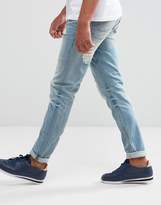 Thumbnail for your product : ASOS Design Tall Skinny Jeans In Light Wash With Heavy Rips