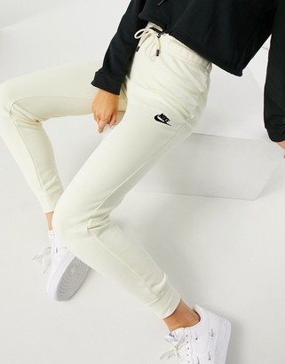 Nike essential tight fit fleece track pants in off