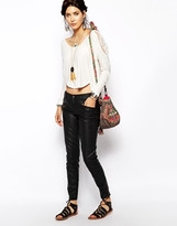 Thumbnail for your product : Free People Skinny Trousers in Vegan Leather - Black