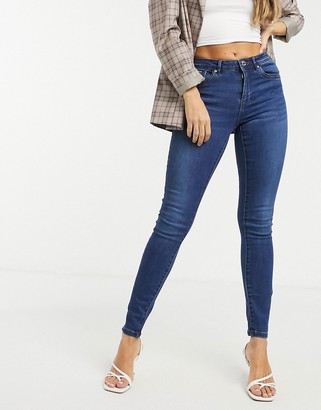 Vero Moda Tanya skinny jeans with mid rise in dark blue denim - ShopStyle