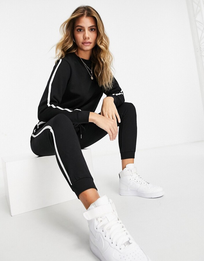 ASOS DESIGN tracksuit sweat / basic jogger with contrast binding in cotton  in black - BLACK - ShopStyle Activewear Trousers