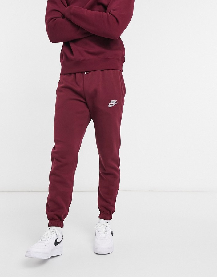 Nike Club reflective logo casual fit cuffed sweatpants in burgundy -  ShopStyle