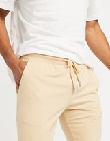 Thumbnail for your product : ASOS DESIGN co-ord lightweight super skinny joggers in beige