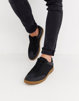 black trainers with gum sole