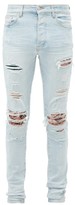 Thumbnail for your product : Amiri Distressed Printed-patch Skinny-leg Jeans - Blue