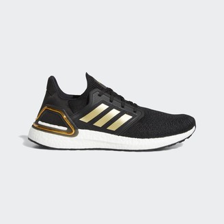 black and gold adidas trainers