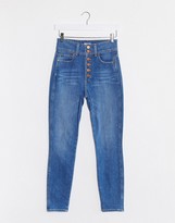 Thumbnail for your product : Alice + Olivia Jeans high rise skinny jeans with exposed buttons in blue