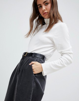 ASOS DESIGN DESIGN tapered boyfriend jeans with curved seams and belt in black ShopStyle
