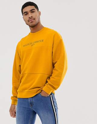 ASOS Design DESIGN oversized sweatshirt withreverse loopback panel with text print in yellow