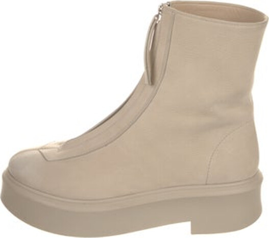 The Row Zipped Boot I Mid-Calf Combat Boots Neutrals Leather Round-Toes Platform Concealed Zip Closure at Uppers Unfortunately, due to restrictions, this item may not be eligible for shipping in all areas.